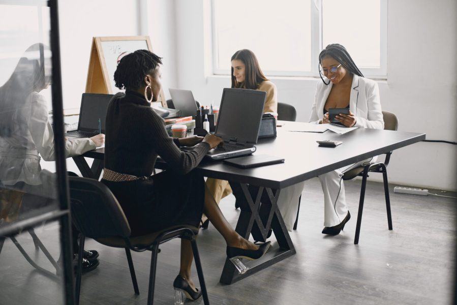 Multicultural businesswomen in group meeting. Full concentration at work. Business teamwork concept.
